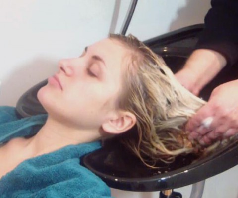 BEAUTIFUL BLOND BEING SHAMPOOED
