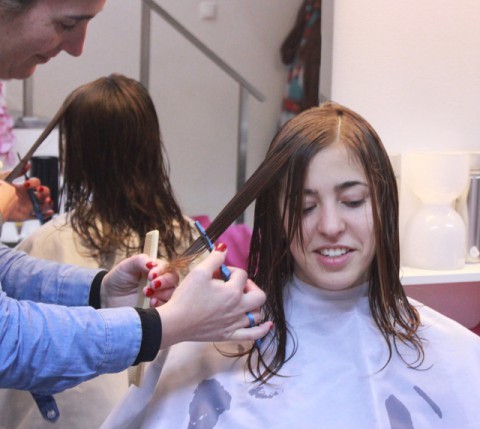TONS OF HAIR SACRIFIED BY RAZOR BLADE IN A LAYERED HAIR SCULPTURE
